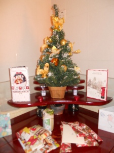 Our little shrine to Christmas, complete with tree and presents